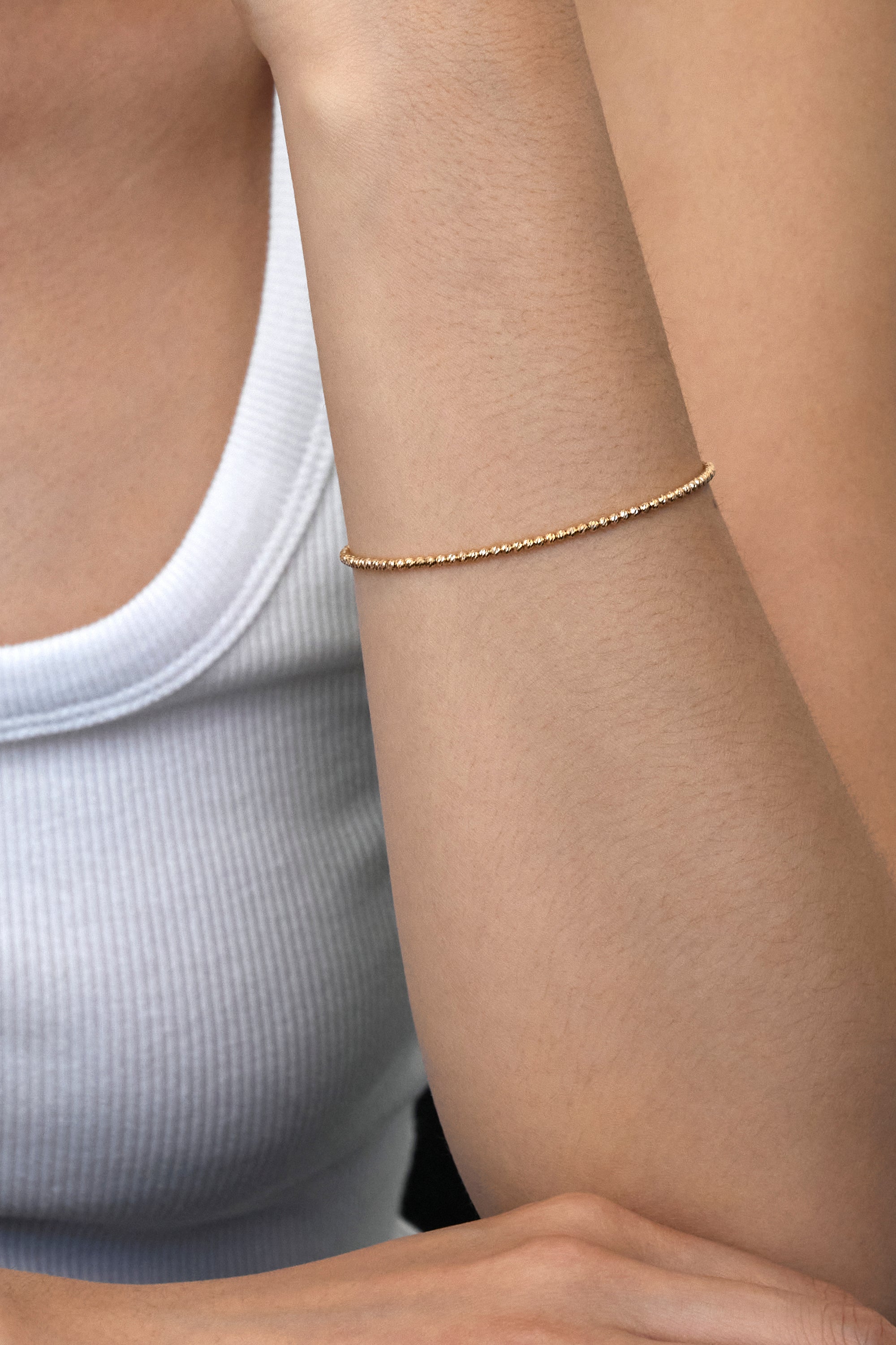 FACETED BALL CHAIN BRACELET IN GOLD