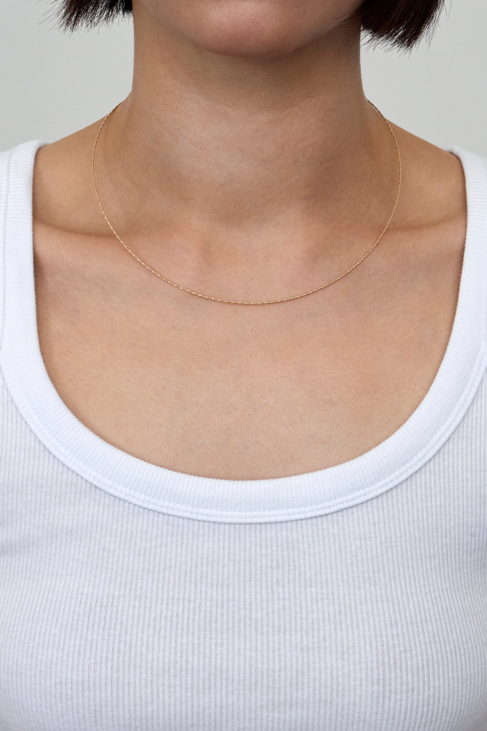 TITANIUM CORE OVAL LINK NECKLACE IN GOLD
